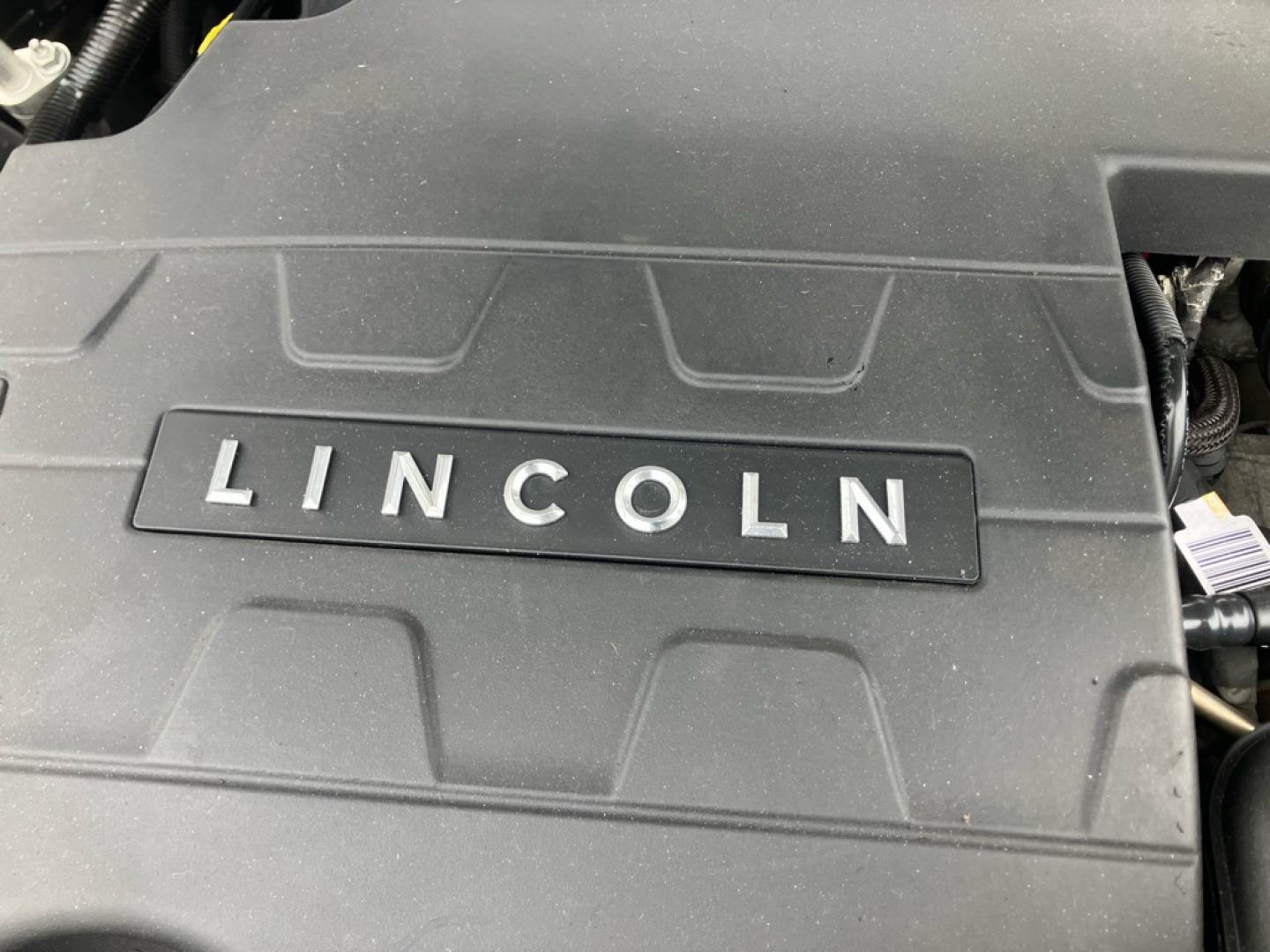 2015 BLACK LINCOLN MKS (1LNHL9EK8FG) with an 3.7L engine, Automatic transmission, located at 1708 Broadway, Rockford, IL, 61104, (815) 397-5010, 42.252522, -89.069359- Photo#10