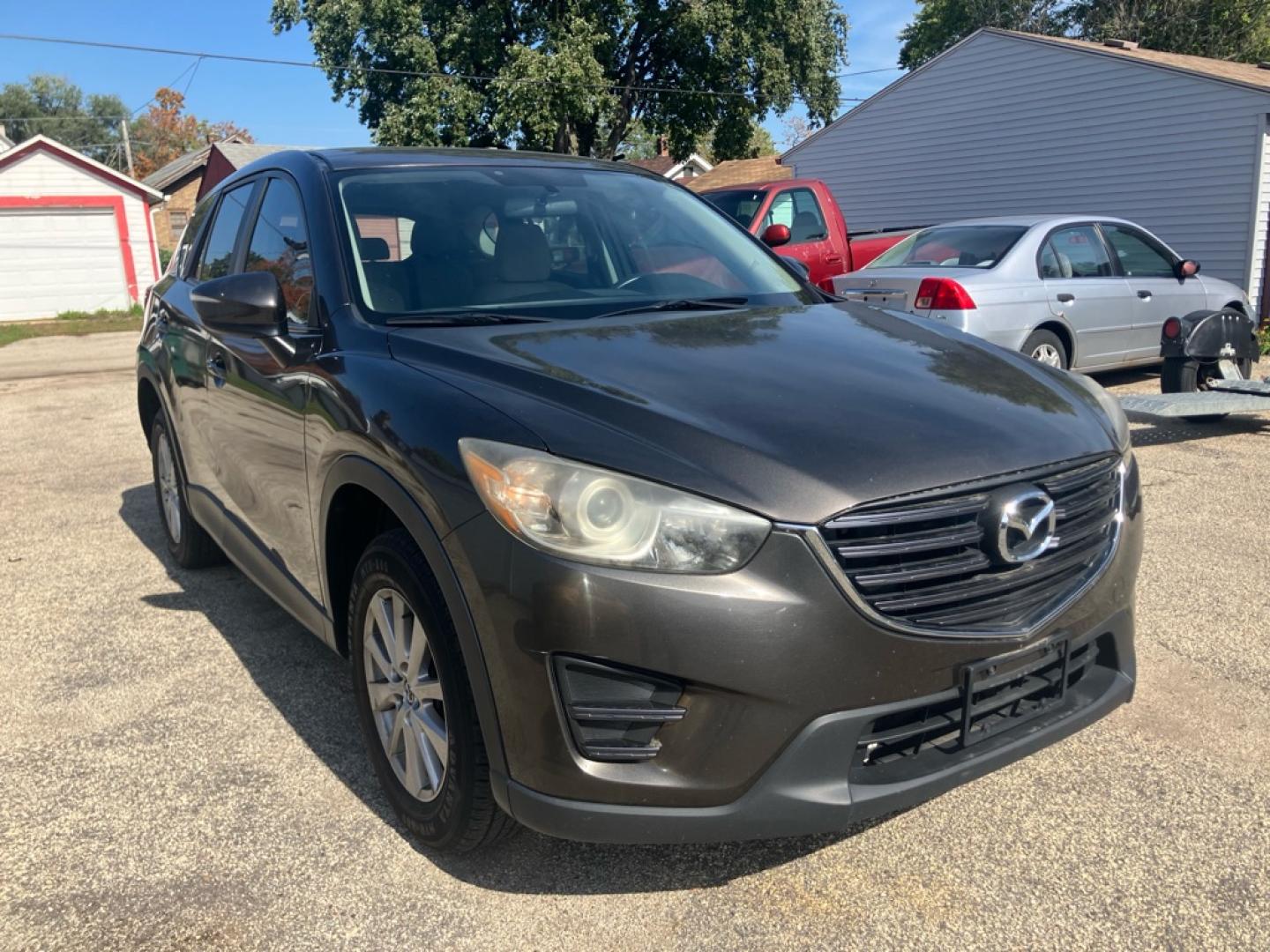 2016 BROWN MAZDA CX-5 SPORT (JM3KE2BYXG0) with an 2.5L engine, Automatic transmission, located at 1708 Broadway, Rockford, IL, 61104, (815) 397-5010, 42.252522, -89.069359- Photo#1