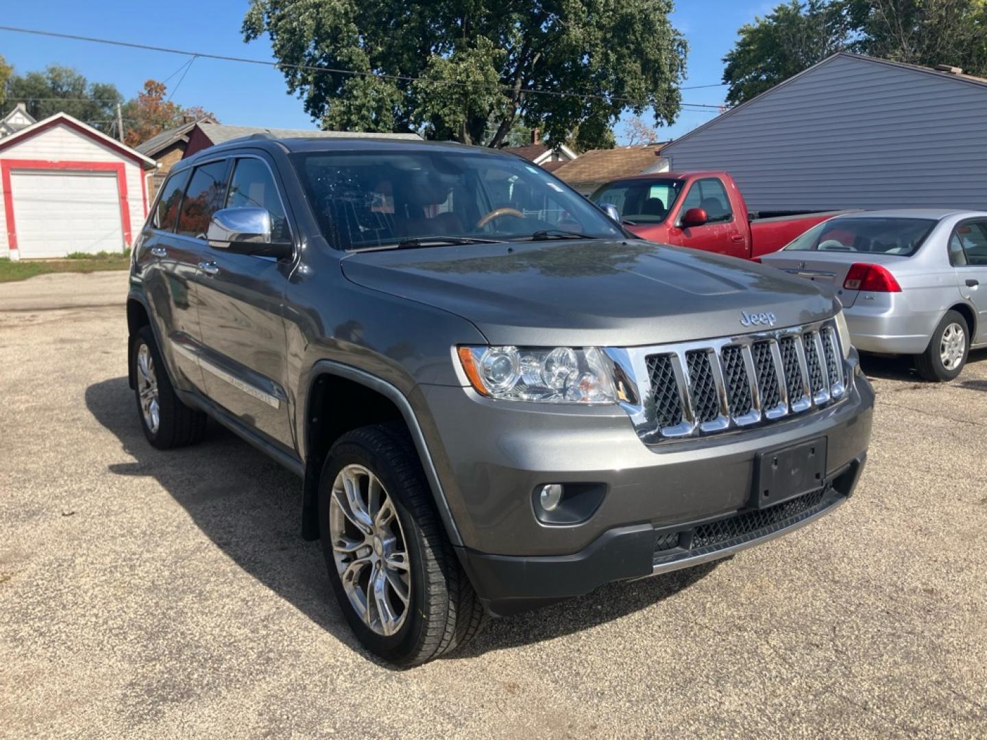 2011 GRAY JEEP GRAND CHEROKEE OVERLAND (1J4RR6GG5BC) with an 3.6L engine, Automatic transmission, located at 1708 Broadway, Rockford, IL, 61104, (815) 397-5010, 42.252522, -89.069359- Photo#1